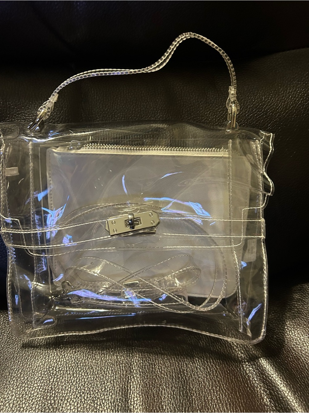 3 pc. : Clear plastic purse, internal white pouch,  & neck/shoulder strap.